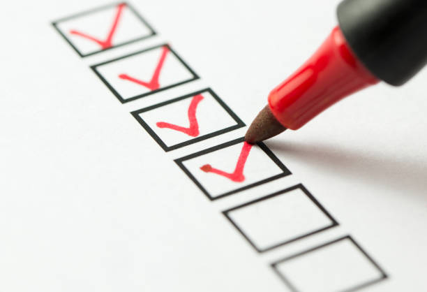 Red pen ticking checklist of eligibility criteria